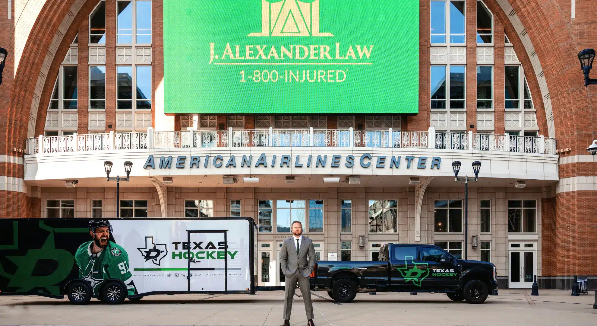 J. Alexander Law Firm billboard at the American Airlines Center in Dallas