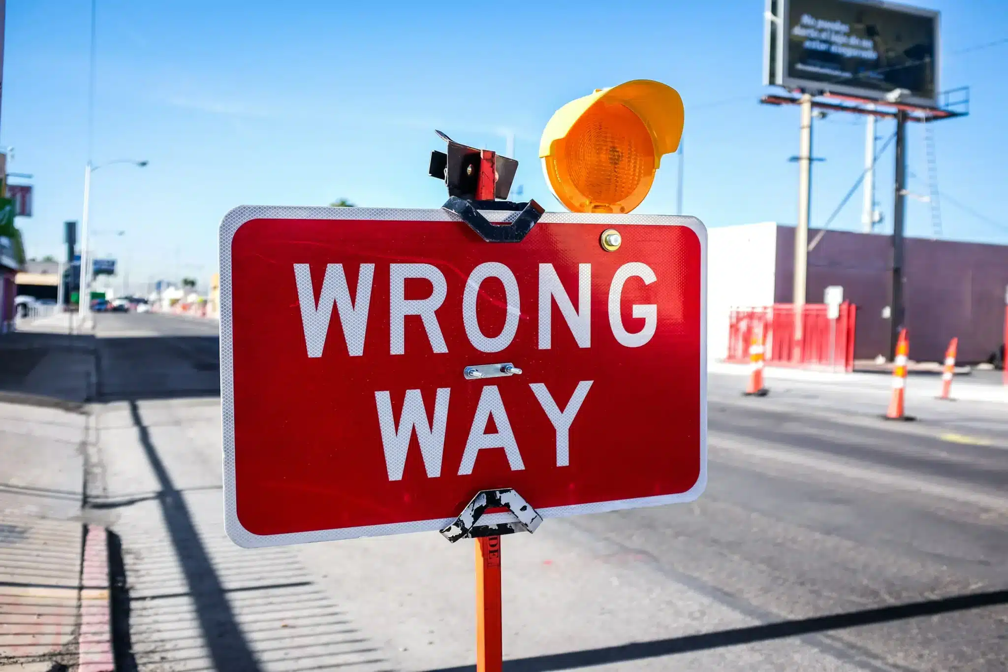 Red and white WRONG WAY road sign