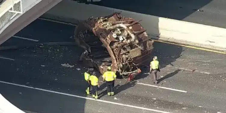 An overturned vehicle on I 635 surrounded by emergency responders