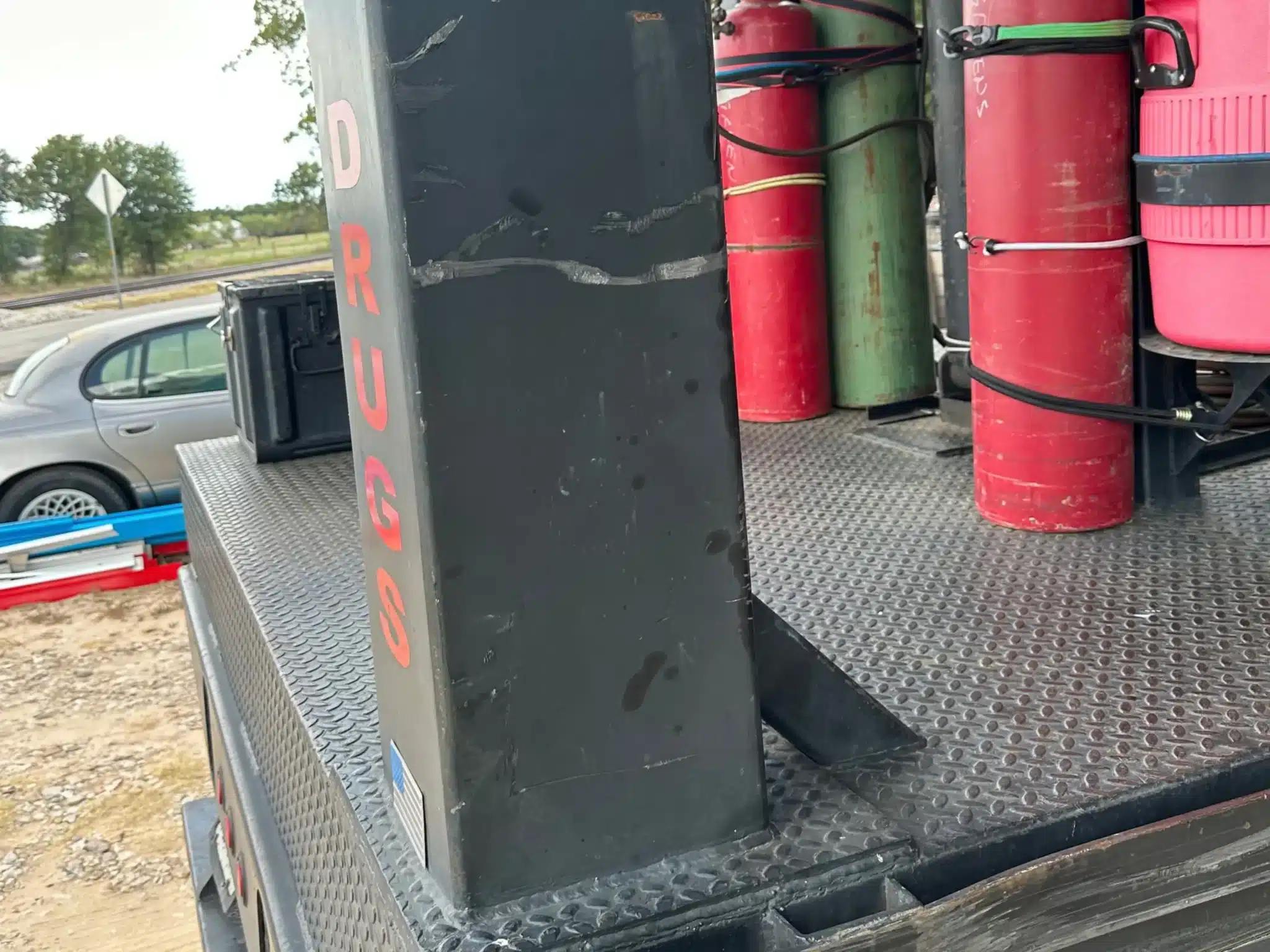 The commercial trailer's deck, cylinders, and equipment cabinet photographed after the crash near Cresson