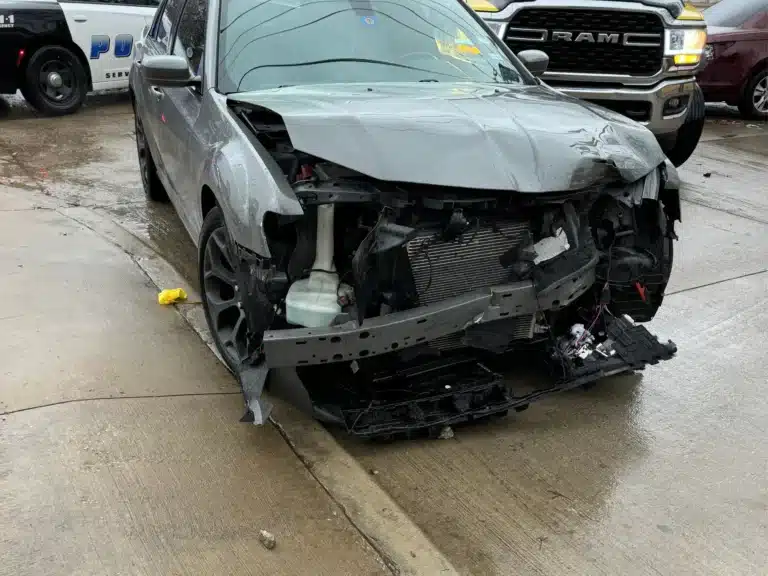 Front damage to the Chrysler 300 after the Dallas collision
