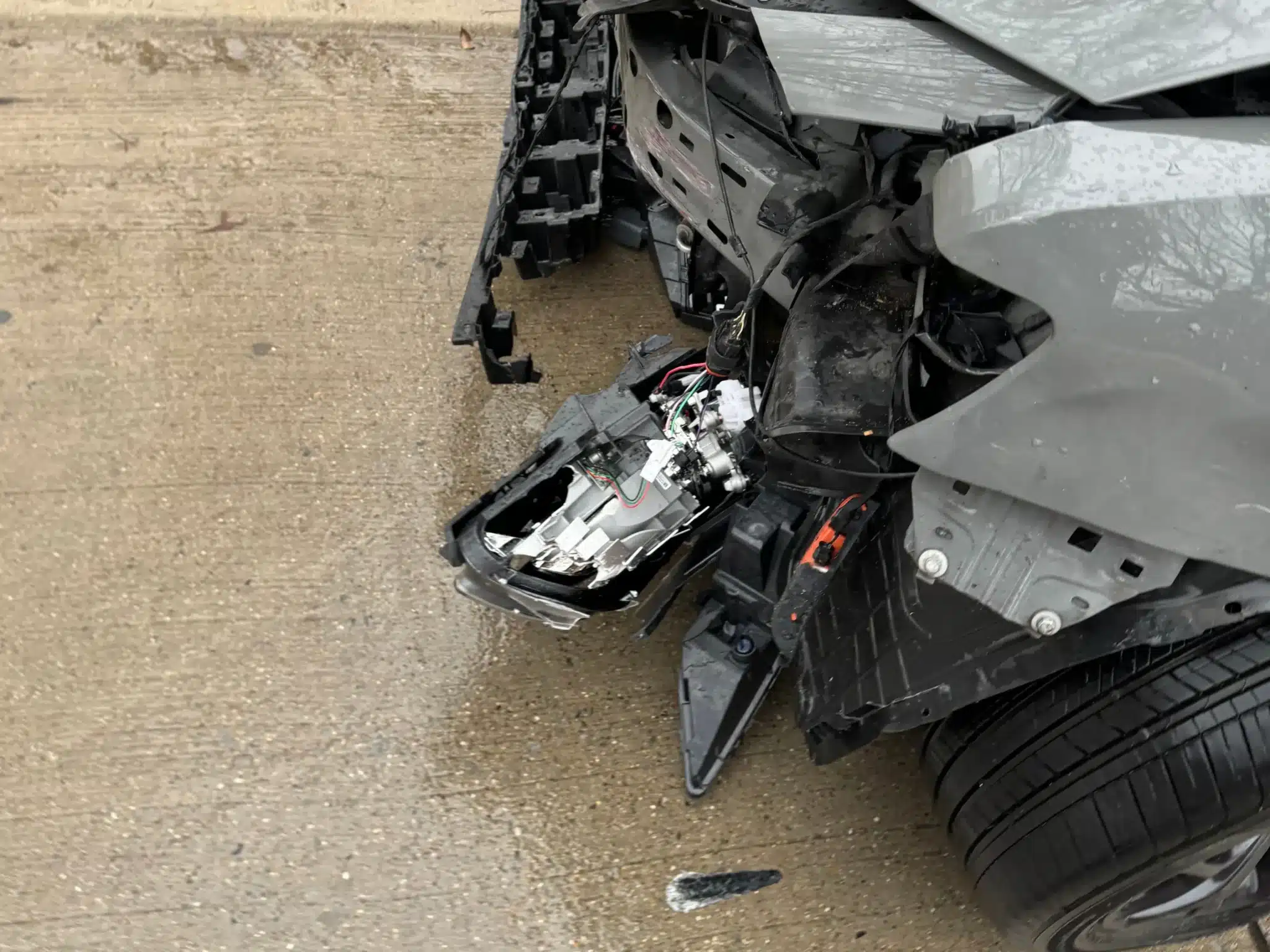 Close up of front bumper damage after the Dallas collision